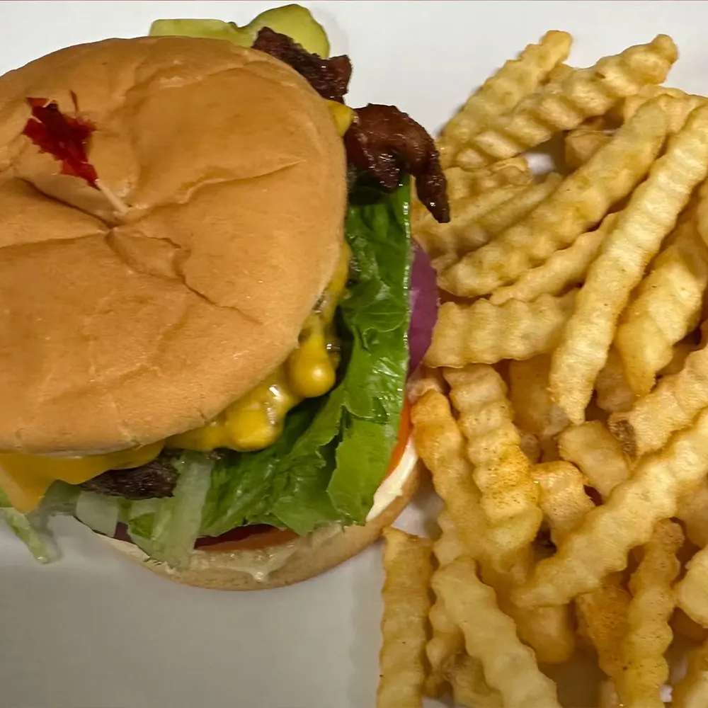 This is bacon cheese burger , lettuce, tomato, pickles, and cheddar cheese